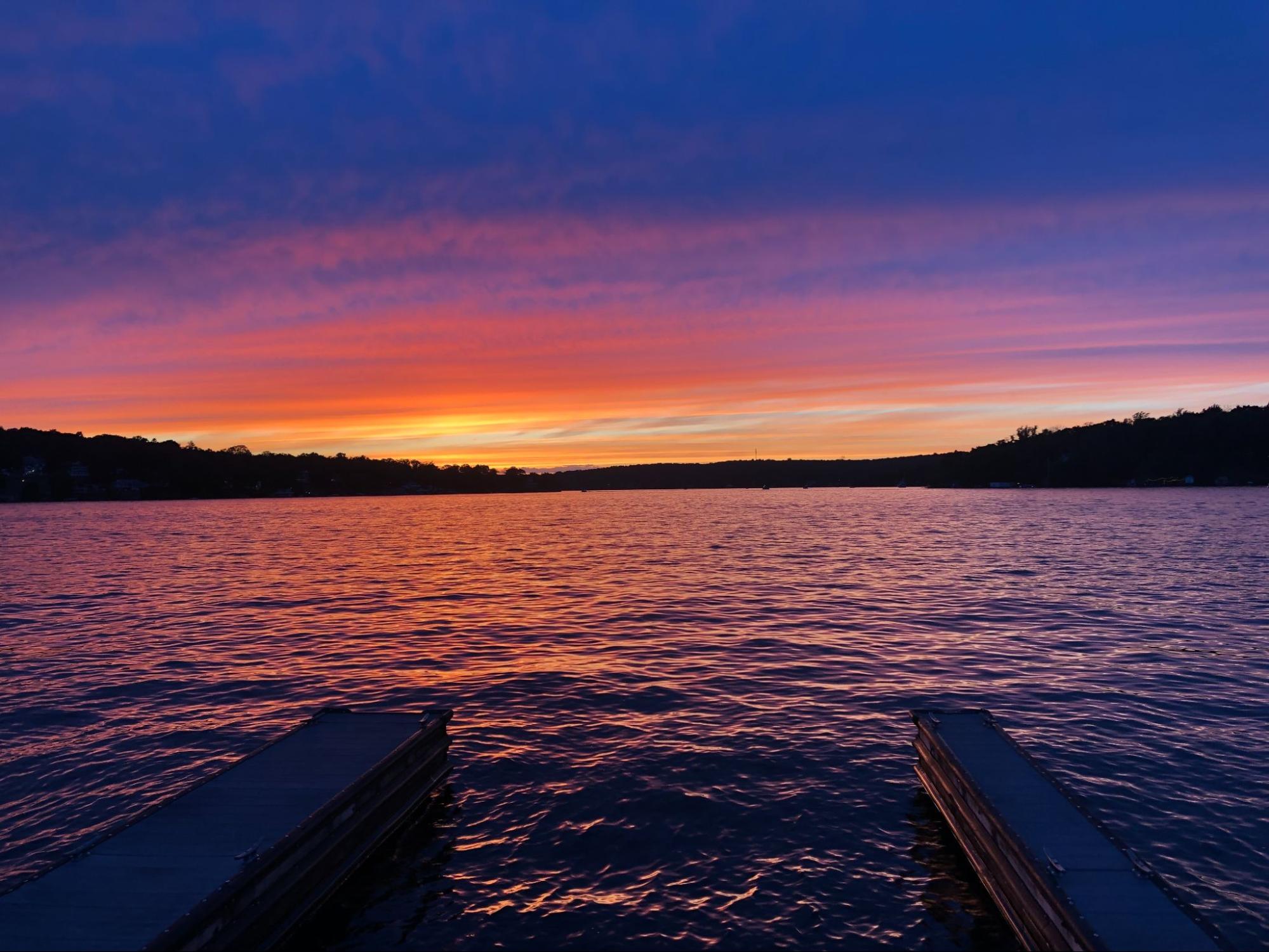 A sunset over the waters of Lake Hopatcong from the dock of The Windlass