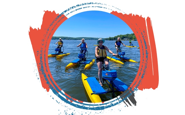 Group riding hydrobikes at sunset on Lake Hopatcong