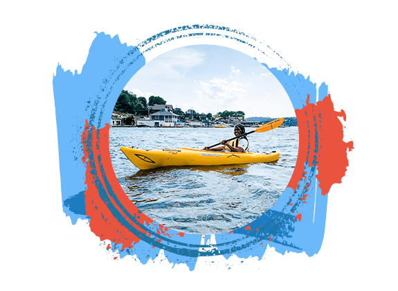 Young woman smiling as she paddles her single yellow kayak on Lake Hopatcong with various blue and orange paint splatter texture framing the circler image